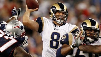Sam Bradford, centre, and the St Louis Rams will play three games in London's Wembley over the next three seasons, starting with the New England Patriots in 2012.