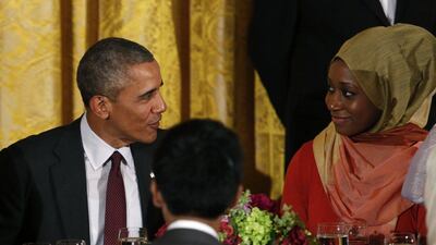 US President Barack Obama talks to a guest during an iftar dinner celebrating Ramadan in the State Dining Room at the White House in Washington, DC on Monday. Yuri Gripas / AFP