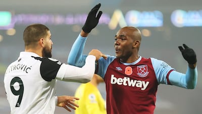 Angelo Ogbonna, right, of West Ham and Aleksandar Mitrovic of Fulham during the Premier League match in London. EPA