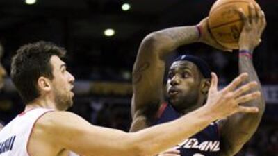 LeBron James, right, scored a triple-double for the Cleveland Cavaliers, but it was not enough to see off the Toronto Raptors.