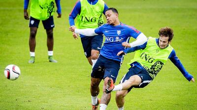 Memphis Depay and Daley Blind of the Netherlands compete during a team training session on Tuesday ahead of their match against Kazakhstan on Saturday in Euro 2016 qualifying. Robin van Lonkhuijsen / EPA