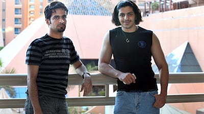 Bander, left, and Turky al Otaibi relax at a Cairo hotel. Bander says the hotline idea is only a partial solution.