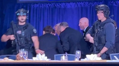 U. S. President Donald Trump is escorted out as a shooter opens fire during the annual White House Correspondents' Association dinner in Washington, D. C. , U. S. , April 25, 2026, in this screen capture from video. REUTERS/Bo Erickson THIS IMAGE WAS PROCESSED BY REUTERS TO ENHANCE QUALITY, AN UNPROCESSED VERSION HAS BEEN PROVIDED SEPARATELY. TPX IMAGES OF THE DAY