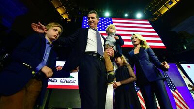 California's Democratic gubernatorial candidate Gavin Newsom and his family arrives on stage at his election night watch party in Los Angeles, California. AFP