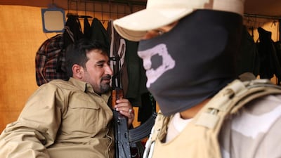 Sunni tribal leader Nazhan Sakher takes a rest while holding his Kalashnikov inside a tent on the frontline in northern Iraq. Al Lehib, the Sunni tribe he is from, initially welcomed ISIL militants when they swept across northern Iraq last summer , but they have since turned against them after seeing their brutal rule. Bram Janssen/AP Photo