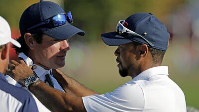Tiger Woods, right, was an assistant captain for Team USA during their Ryder Cup triumph at Hazeltine last week. Charlie Riedel / AP Photo