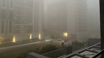 Residential buildings in Al Zeina are obscured by the fog