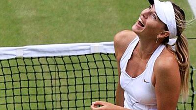 Maria Sharapova celebrates after defeating Sabine Lisicki after their semi-final match.