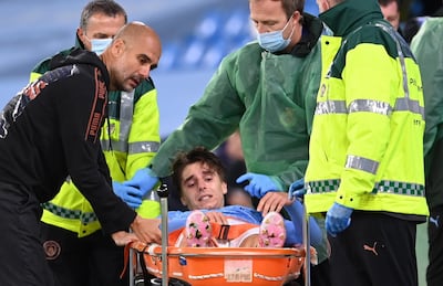 Adrian Bernabe of Manchester City is stretchered off injured. EPA