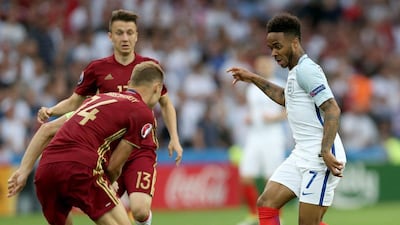 Raheem Sterling (R) of England and Vasili Berezutski (L) of Russia in action during the Uefa Euro 2016 group B preliminary round match between England and Russia at Stade Velodrome in Marseille, France, 11 June 2016. Tolga Bozoglu / EPA