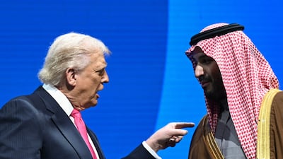Saudi Arabia's Crown Prince Mohammed bin Salman with US President Donald Trump. Mr Trump has tied the US-Saudi nuclear deal to the kingdom signing the Abraham Accords with Israel. AFP
