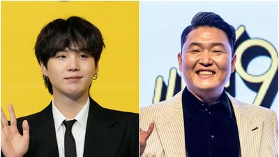 BTS member Suga, left, and solo star Psy released the single That That. AP Photo / AFP