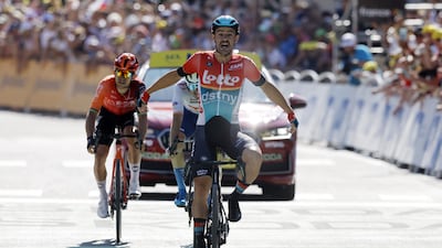 Lotto Dstny rider Victor Campenaerts celebrates as he crosses the finish line to win the 179km-long Stage 18 of the Tour de France. EPA