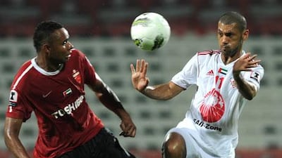 Jakson Coelho, left, tries to get between a pass to Sharjah's Saeed Al Kas.