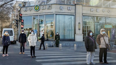 Mask-wearing is still common on the streets of Beijing. Reuters