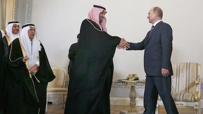 Russian president Vladimir Putin shakes hands with Saudi Arabia's defence minister Prince Mohammed bin Salman in St Petersburg, Russia. Grigory Dukor / Pool Photo via AP