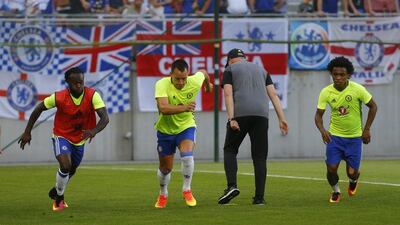 Chelsea winger Victor Moses, defender John Terry and midfidler Willian warm up before the match. Heinz-Peter Bader / Reuters
