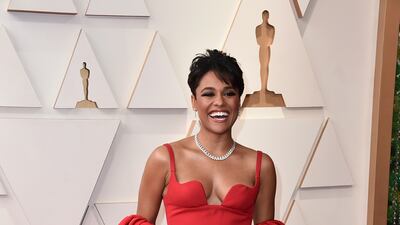 Ariana DeBose, wearing a caped red Valentino two-piece. AP