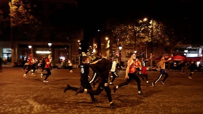 Paris Saint-Germain supporters running on the Champs-Elysees. AFP