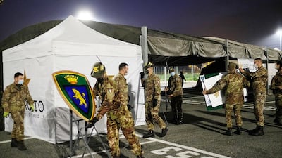 Preparations of the new Covid-19 hotspot test centre assembled by the Italian army in front of the Allianz stadium in Turin. EPA