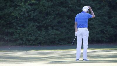 Jordan Spieth of the US reacts after hitting into Rae’s Creek a second time on the twelfth hole during the final round of the 2016 Masters Tournament at the Augusta National Golf Club in Augusta, Georgia, USA, 10 April 2016. The Masters Tournament is held 07 April through 10 April 2016. EPA/ERIK S LESSER