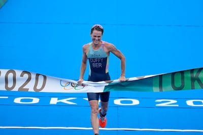Flora Duffy crosses the finish line to win triathlon gold at the 2020 Olympics in Tokyo. AP