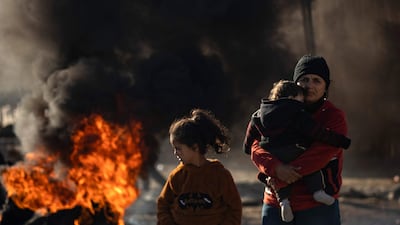 Syrian Kurds flee their homes in the outskirts of Aleppo. AFP