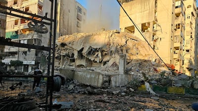 Rubble strewn across Al Kafaat at the site of an Israeli attack on southern Beirut. Israel carried out dawn air raids on three neighbourhoods in the capital, hitting a residential building. AFP