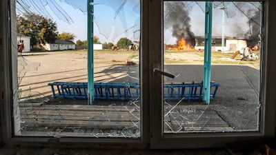 A fire burns at a factory following shelling during fighting over the separatist region of Nagorno-Karabakh. AP