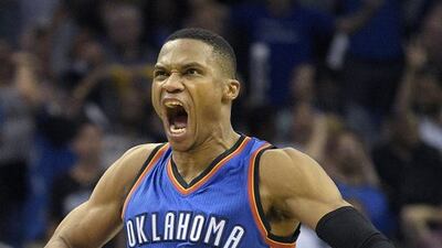 Oklahoma City Thunder guard Russell Westbrook celebrates after scoring at the end of regulation to send the game into overtime. Phelan M. Ebenhack / AP Photo