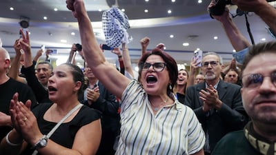 Supporters of Israel's Arab-led Joint List political alliance cheer at the alliance's campaign headquarters in the northern Israeli city of Nazareth on Tuesday. AFP