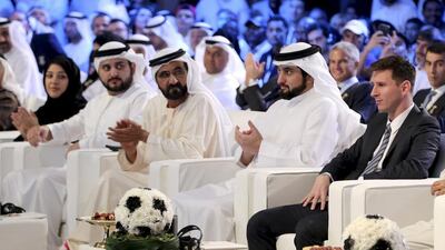 Lionel Messi, right, and Sheikh Mohammed bin Rashid, Vice President and Ruler of Dubai, attend the Dubai International Sports Conference. Ashraf Mohammad / Reuters