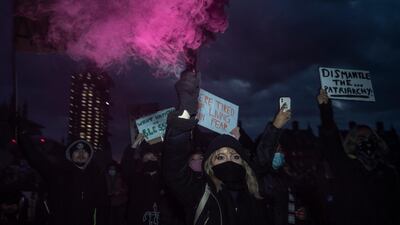 Protesters light a flare in London. Getty Images