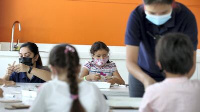 Face masks are currently a must for children and members of staff. Chris Whiteoak / The National