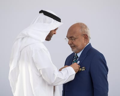 Sheikh Mohammed bin Zayed, Crown Prince of Abu Dhabi and Deputy Supreme Commander of the UAE Armed Forces, presents an Abu Dhabi Award to George Mathew. Ryan Carter for the Crown Prince Court - Abu Dhabi