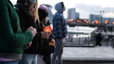 People hold lit candles during a vigil held in memory of Sarah Everard in Cardiff, Wales. Getty Images