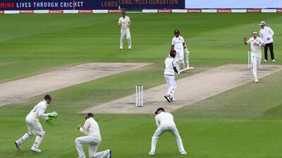 England captain Joe Root takes a catch at first slip takes the wicket of West Indies' Kemar Roach off the bowling of Stuart Broad . AFP