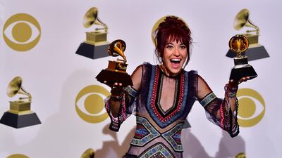 Lauren Daigle poses with her two Grammys in the press room. AFP