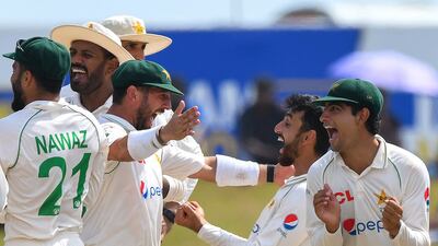 Agha Salman, second right, with teammates after taking the wicket of Sri Lanka's Angelo Mathews. AFP