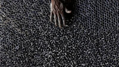 A man works at a firecracker factory to sell their products ahead of Sinhala and Tamil New Year festival, in Kimbulapitiya, Sri Lanka. Reuters