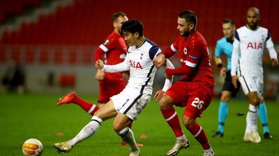 Son Heung-Min of Tottenham is challenged by Jeremy Gelin of Royal Antwerp. Getty