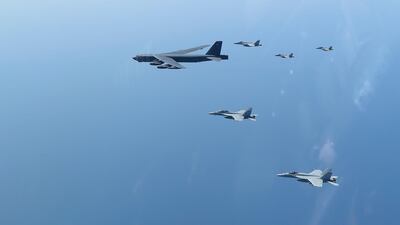 The Abraham Lincoln Carrier Strike Group and a US Air Force B-52H Stratofortress, assigned to the 20th Expeditionary Bomb Squadron and part of the Bomber Task Force deployed to the region, conducting joint exercises in the US Central Command area of responsibility, in the Arabian Sea. EPA