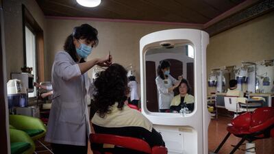 A customer receives beauty treatments at the Changgwang Health Complex in Pyongyang. AFP