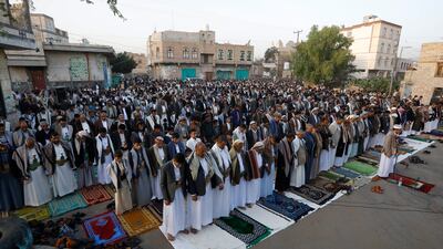 People attend Eid al-Fitr prayers outside a mosque in Sana'a, Yemen. EPA