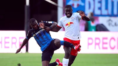Leipzig defender Dayot Upamecano is challenged by Streli Mamba of Paderborn. AFP