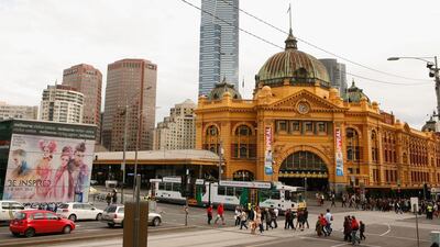 A tram passes Flinders Street Station in Melbourne, Australia. Melbourne looks ripe for a correction these days. Scott Barbour / Getty Images