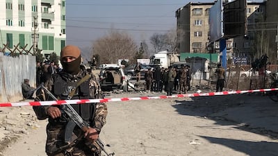 An Afghan security officer keeps watch at the site of a blast in Kabul, Afghanistan on December 15, 2020. REUTERS