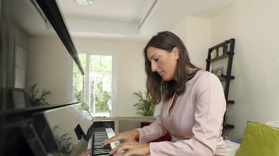 Mercedes started playing piano at the age of eight and is now passing on her skills to others. Chris Whiteoak / The National