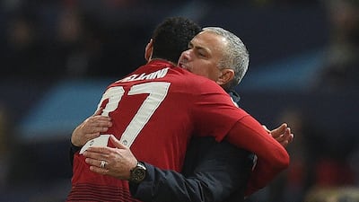 Manchester United's Marouane Fellaini celebrates with manager Jose Mourinho. AFP