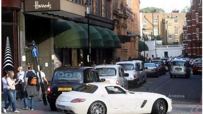 LONDON. 16th August 2010. A high performance supercar flown in from Saudi Arabia drives by the Harrods department store in Knightsbridge, London. Stephen Lock for The National FOR FOREIGN. NOTE: PIXILATE NUMBERS ON LICENCE PLATE